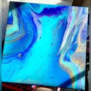 This is a 10x10 acrylic pour painting on stretched canvas.